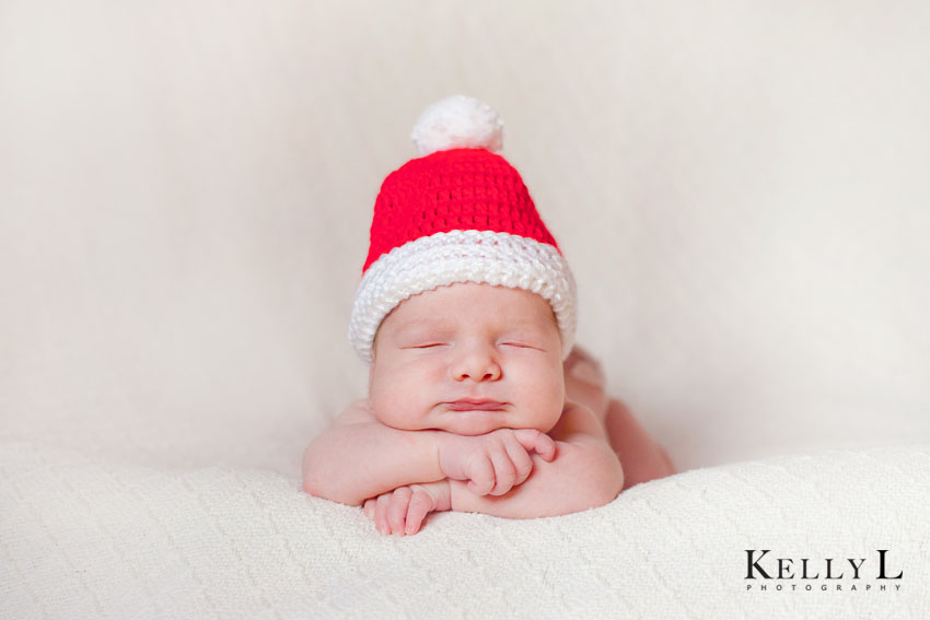 newborn wearing santa hat