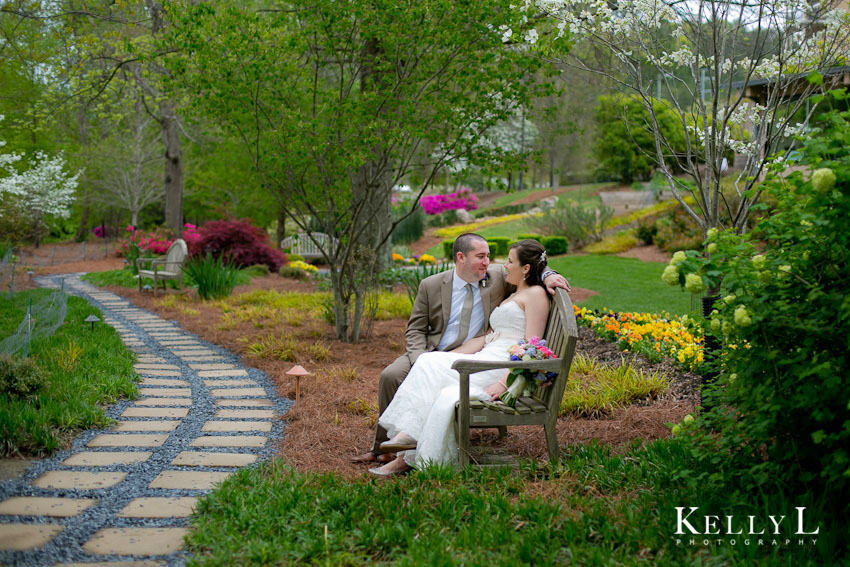 bride and groom sitting in garden