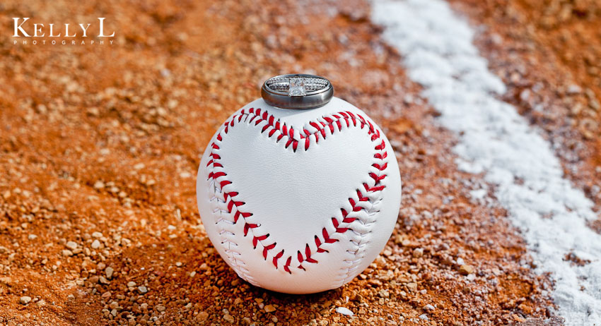 wedding ring on baseball with heart shaped stitching