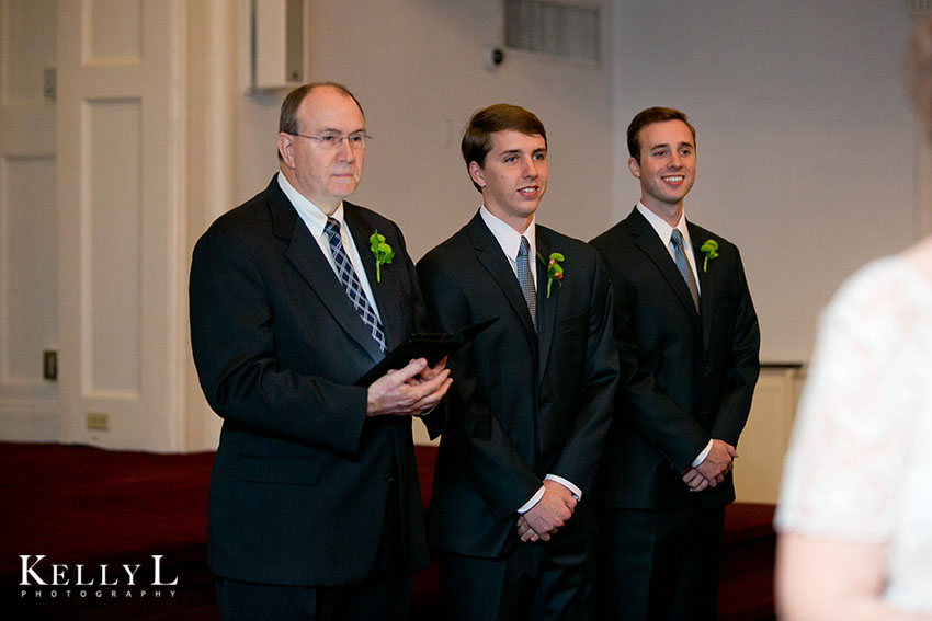 groom sees bride walking down aisle