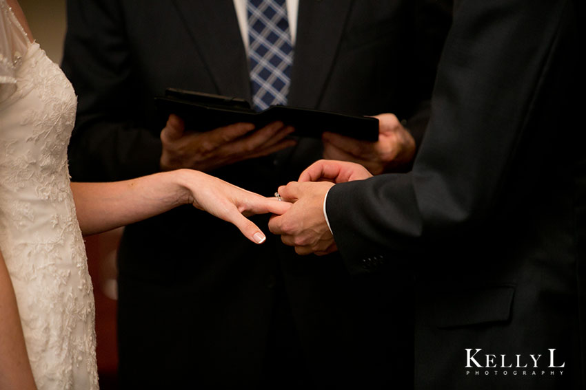 bride and groom exchanging rings