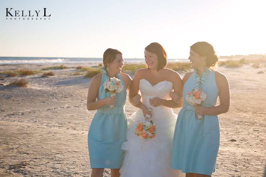 bride and bridesmaids on beach