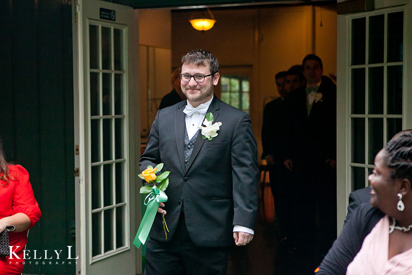 groom walks down aisle 