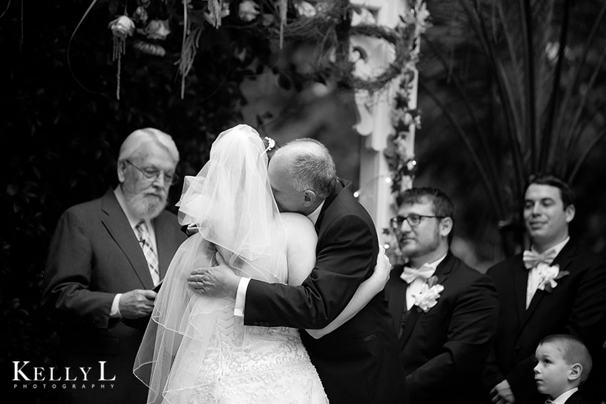 dad and bride hug