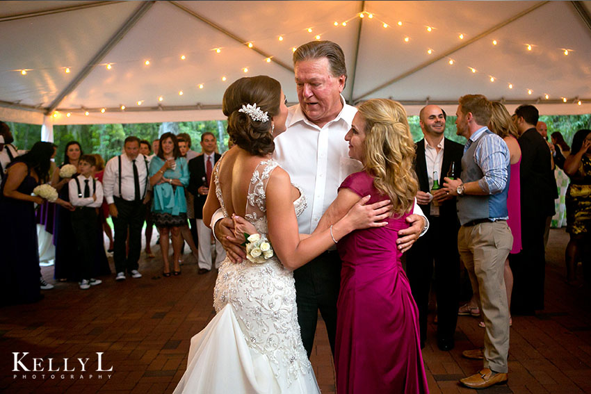 bride dances with her parents
