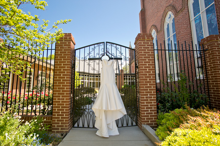 wedding dress hung outside st peter's church
