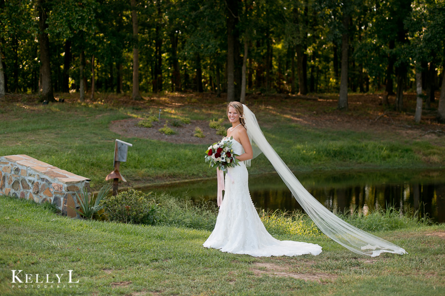 bride by pond and bridge