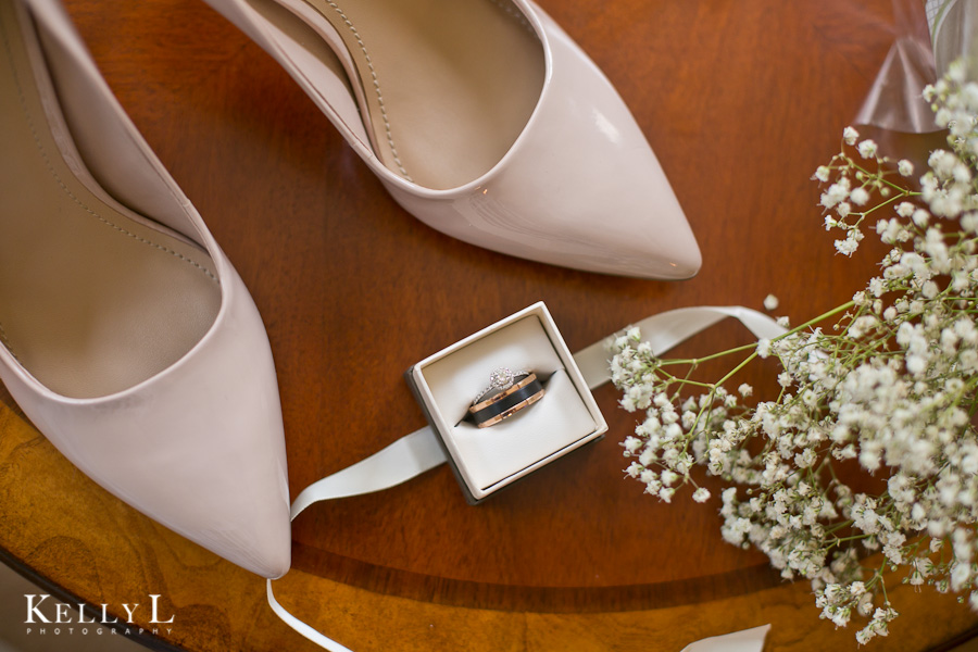 bride's shoes, rings and flowers