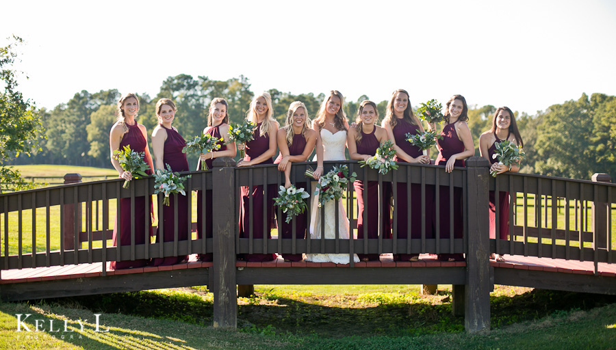 bride and 9 bridesmaids on bridge