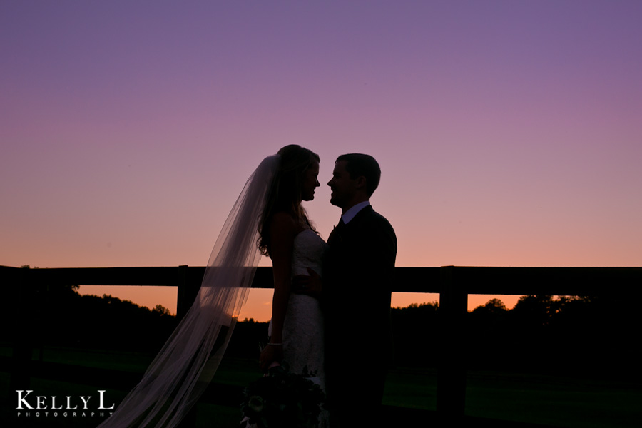 silhouette of bride and groom at sunset 